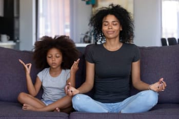 Mother and daughter practicing mindfulness