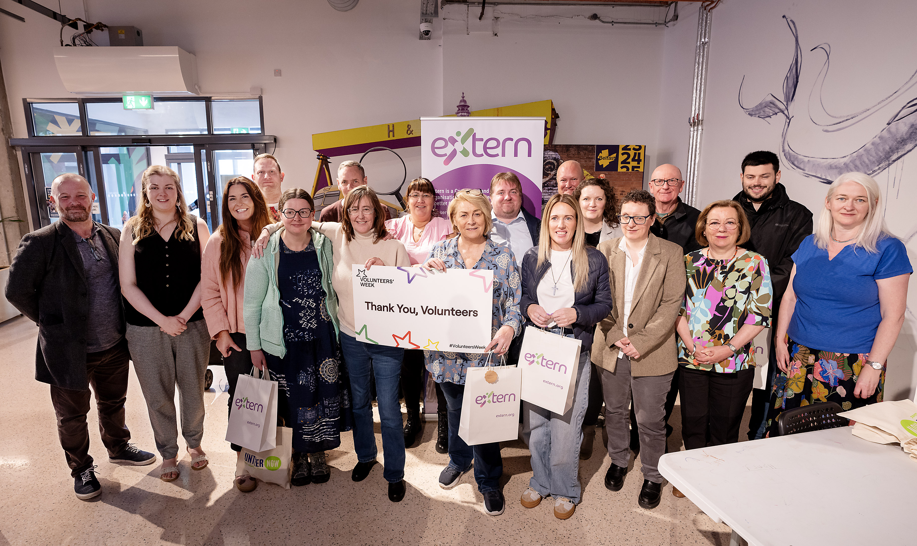 Group image of Extern staff and volunteers at celebration event